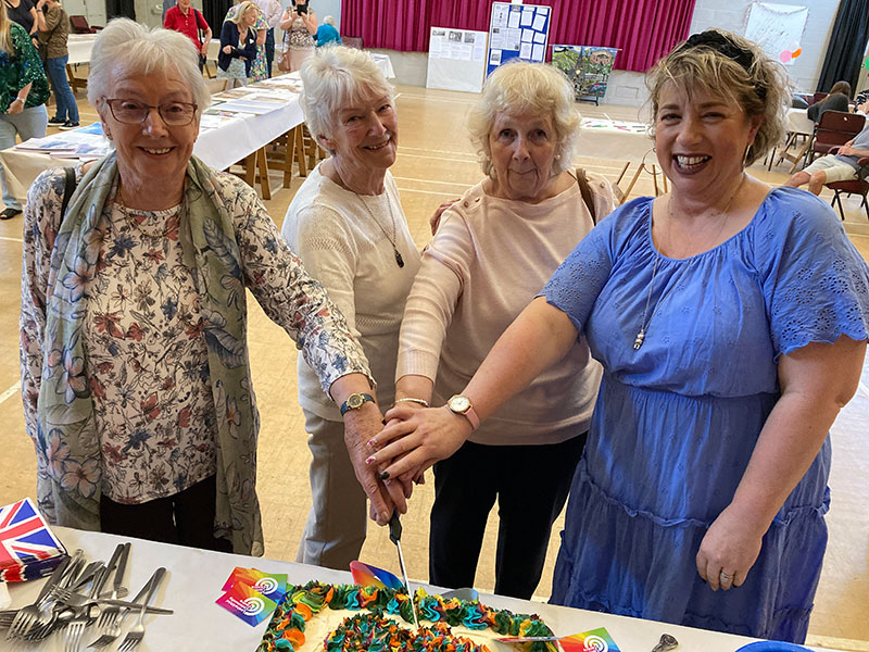 Cutting the cake for the 40th birthday of the Lostwithiel Community Centre
